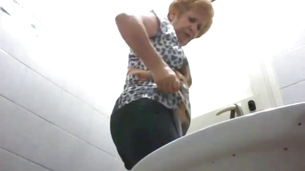 A blonde chick that has nice looking tits is sitting on a cock